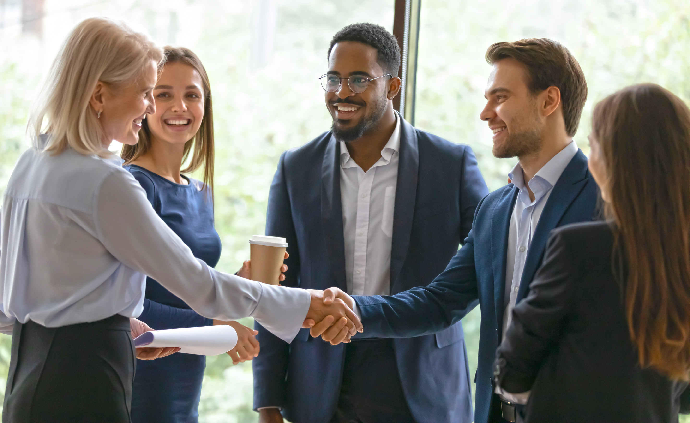 Group-of-professionals-welcoming-a-new-hire to the company